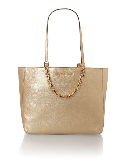 gold michael kors tote bag.